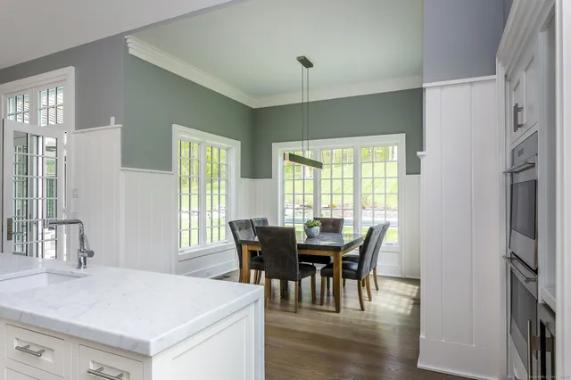 a view of a dining room with furniture and window