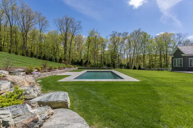 a view of a backyard with green space
