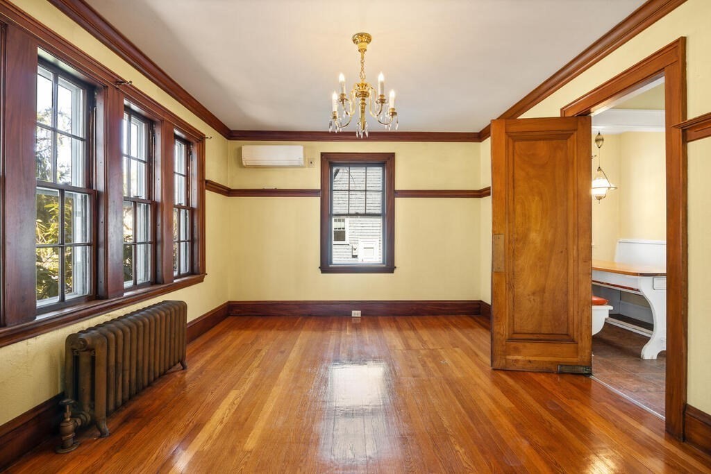 8 Spring Street Lexington, MA 02421 - Photo 12 of 35 a view of an entryway with wooden floor and a window