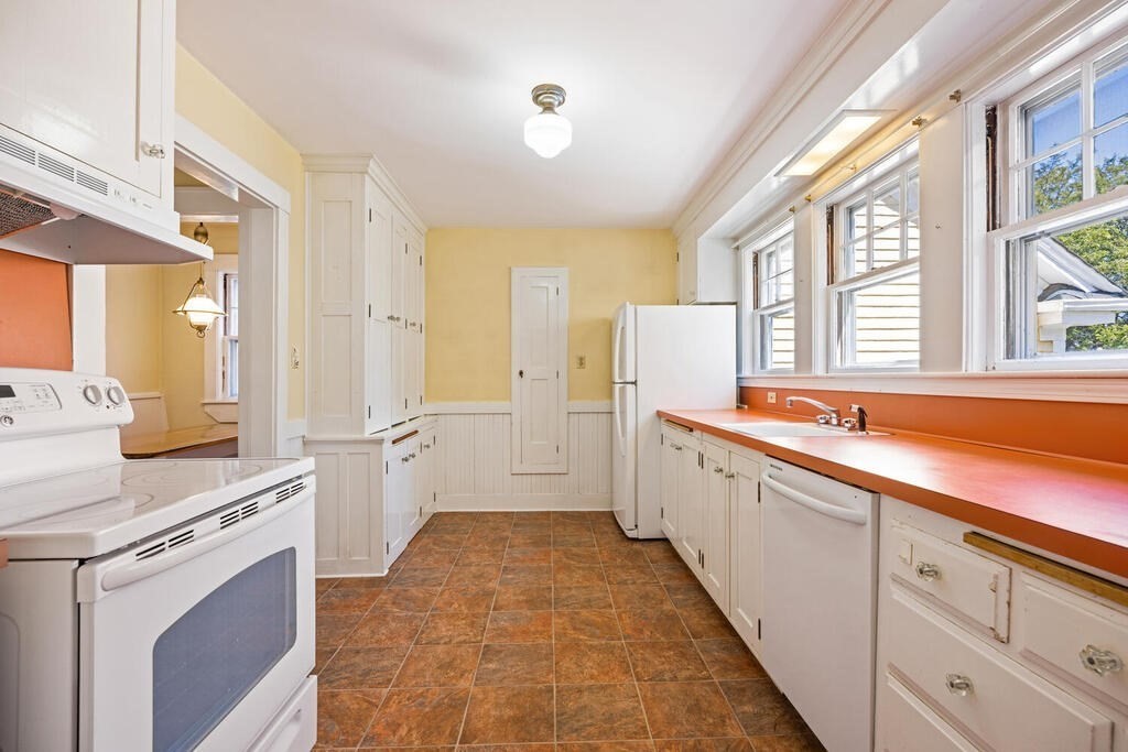 8 Spring Street Lexington, MA 02421 - Photo 18 of 35 a view of a kitchen with a sink and windows