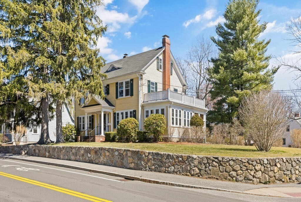 8 Spring Street Lexington, MA 02421 - Photo 2 of 35 a front view of a house with a yard
