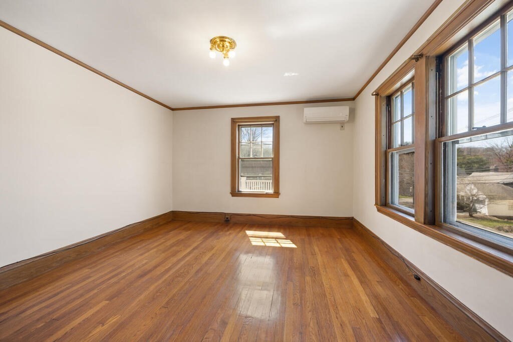 8 Spring Street Lexington, MA 02421 - Photo 24 of 35 a view of an empty room and window