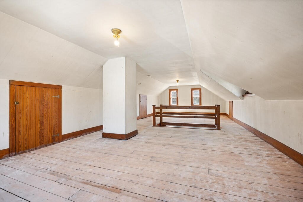 8 Spring Street Lexington, MA 02421 - Photo 25 of 35 a view of room with wooden floor and white walls