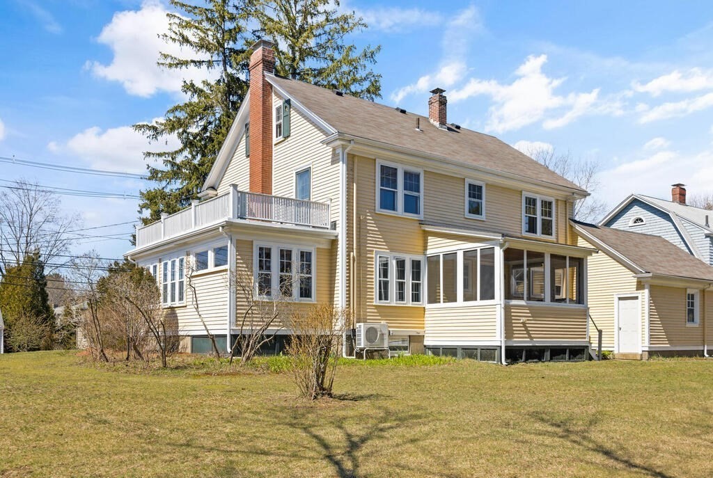 8 Spring Street Lexington, MA 02421 - Photo 3 of 35 a front view of a house with a yard