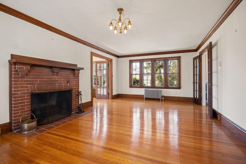 8 Spring Street Lexington, MA 02421 - Photo 10 of 35 a view of an empty room with window and wooden floor