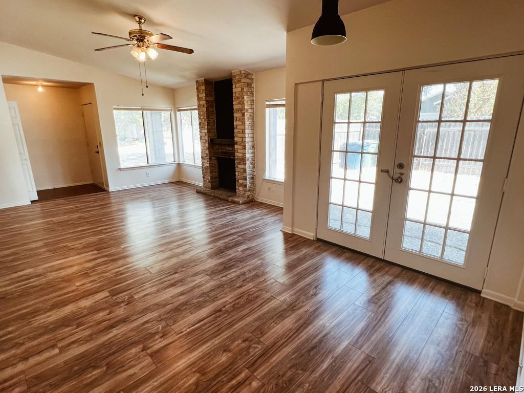 5562 Rangeland San Antonio, TX 78247 - Photo 2 of 9 a view of an empty room with wooden floor and a window