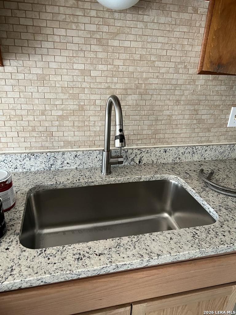 5562 Rangeland San Antonio, TX 78247 - Photo 4 of 9 a bathroom with a sink and granite