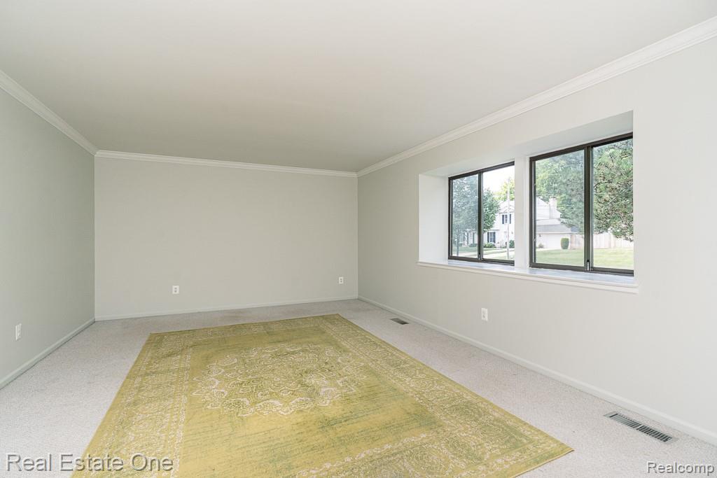 2355 Hillendale Drive Rochester, MI 48309 - Photo 5 of 44 Spacious room with light-colored walls and wall-to-wall carpeting