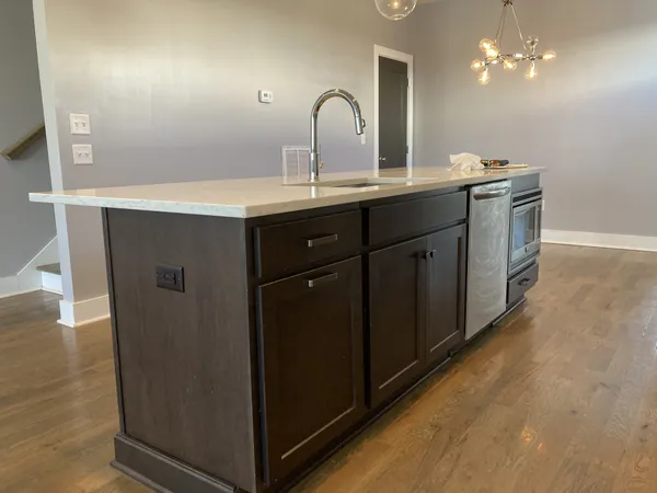 a kitchen with a sink and cabinets