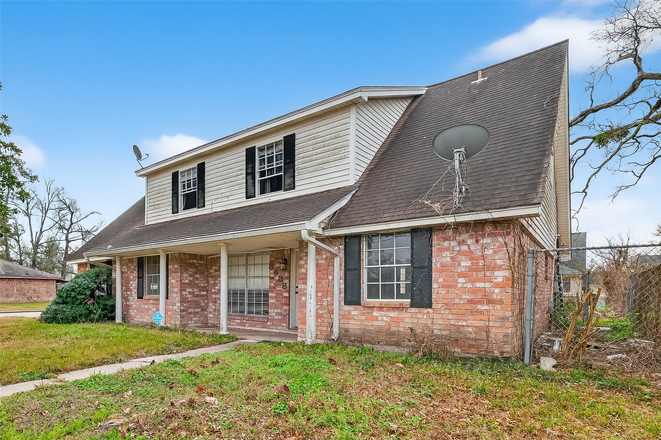 8438 Gallahad Street Houston, TX 77078 - Photo 2 of 36 front view of house with a yard