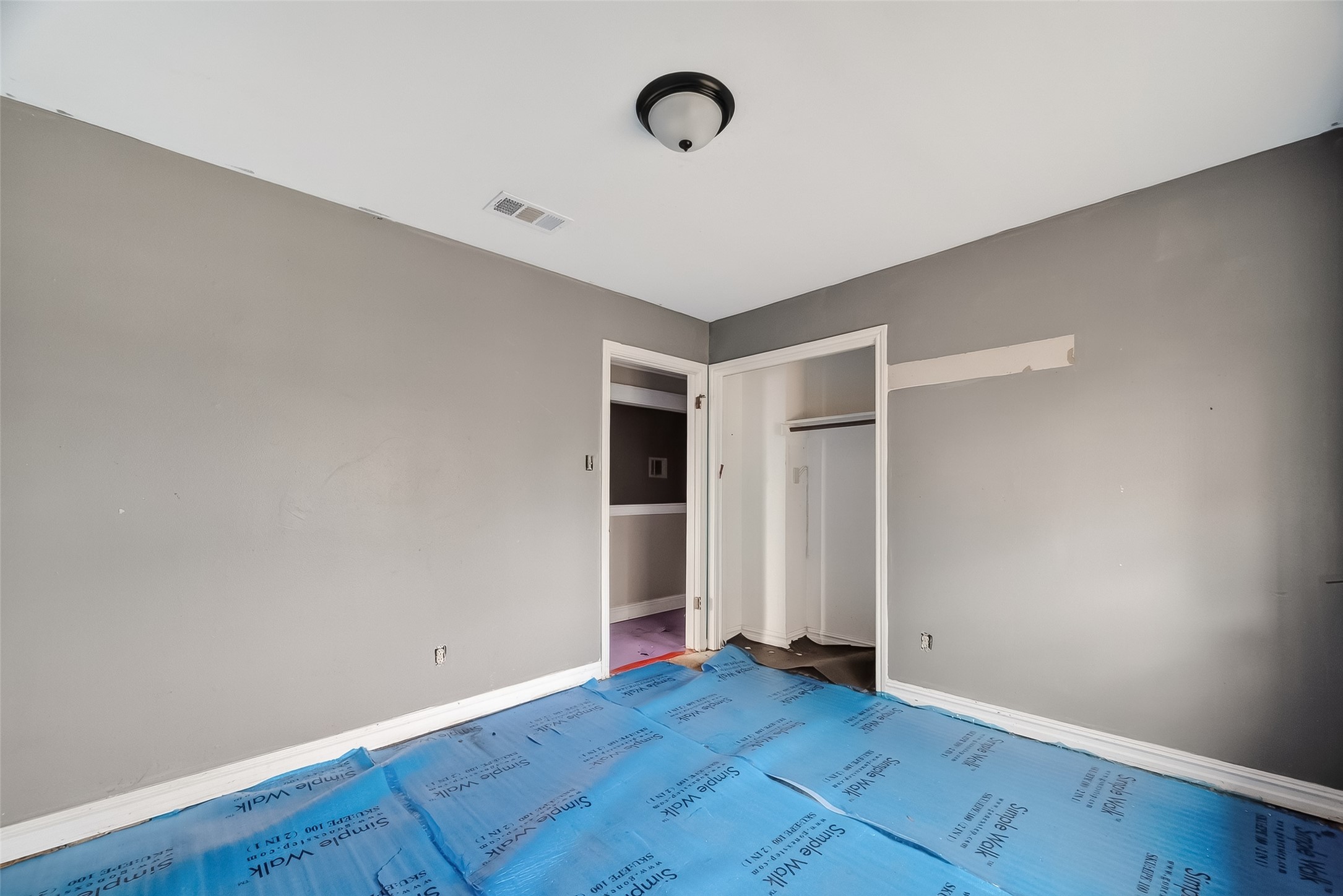 8438 Gallahad Street Houston, TX 77078 - Photo 25 of 36 an empty room with wooden floor and windows