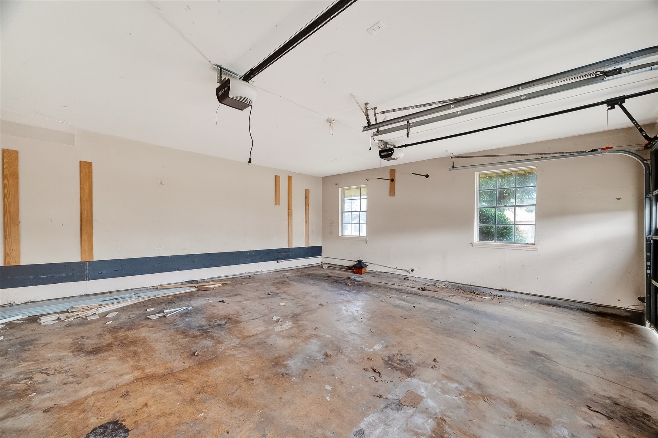 8438 Gallahad Street Houston, TX 77078 - Photo 31 of 36 a view of a big room with wooden floor and windows