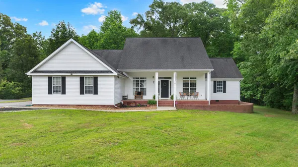 front view of a house with a yard