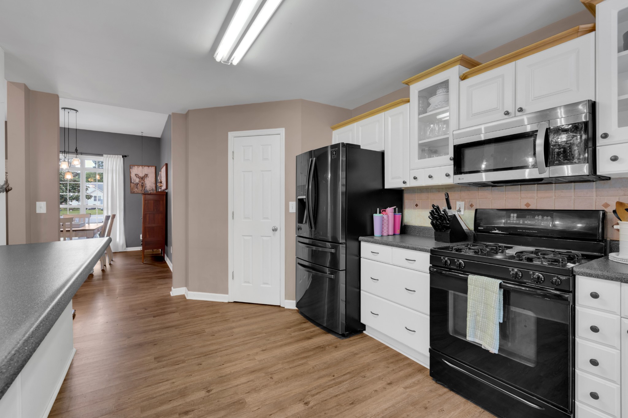 71 Larkspur Court Tullahoma, TN 37388 - Photo 11 of 31 a kitchen with stainless steel appliances a stove microwave and a refrigerator