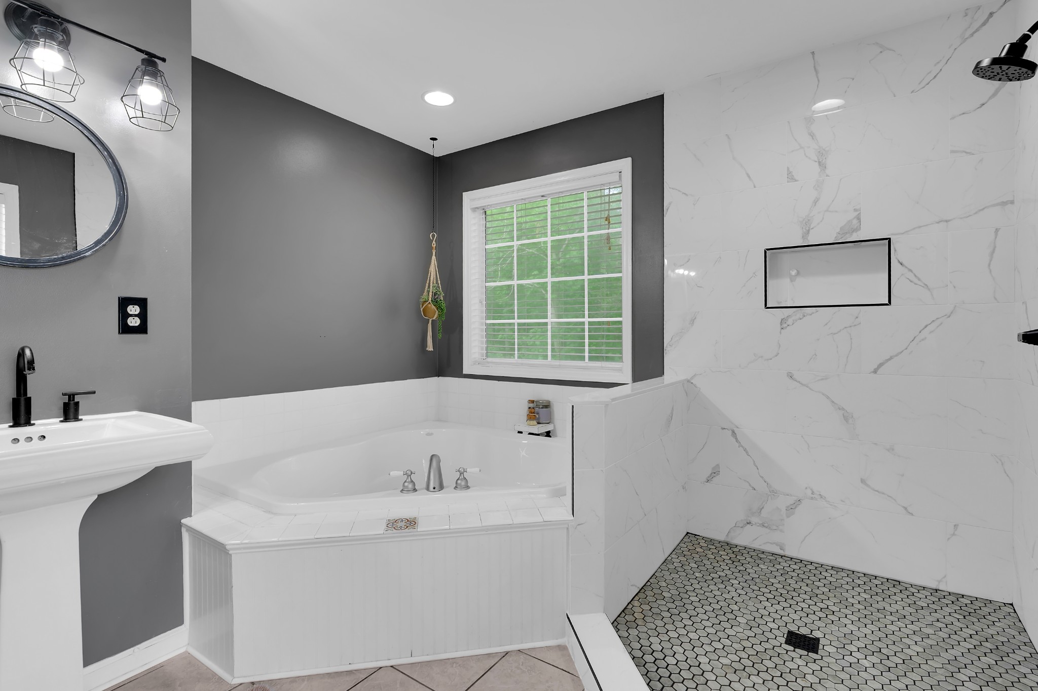 71 Larkspur Court Tullahoma, TN 37388 - Photo 17 of 31 a bathroom with a bathtub a sink and a window