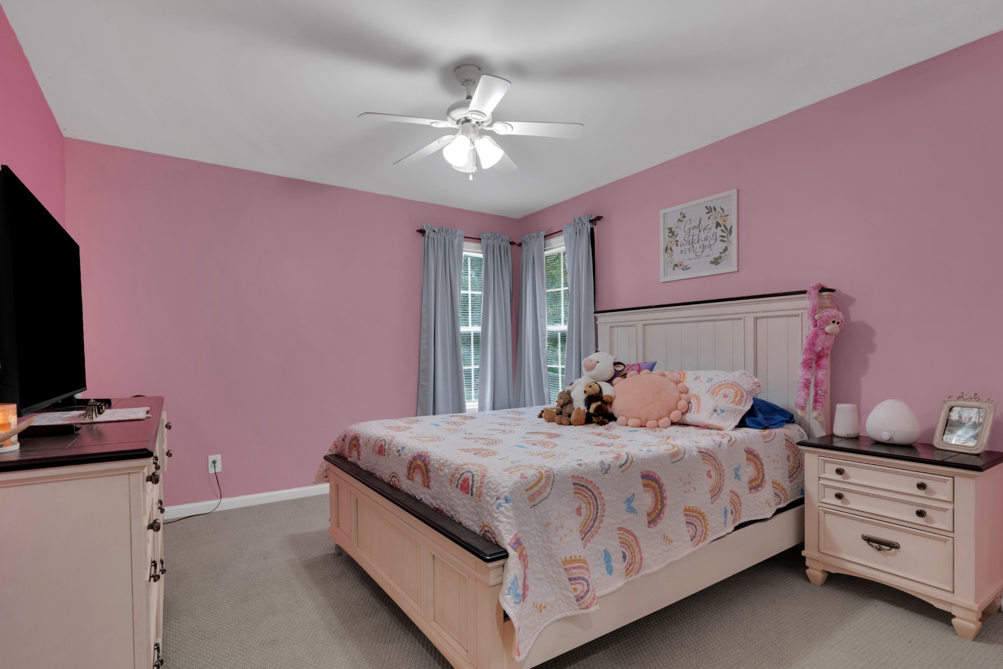71 Larkspur Court Tullahoma, TN 37388 - Photo 24 of 31 a bedroom with a bed and a flat screen tv