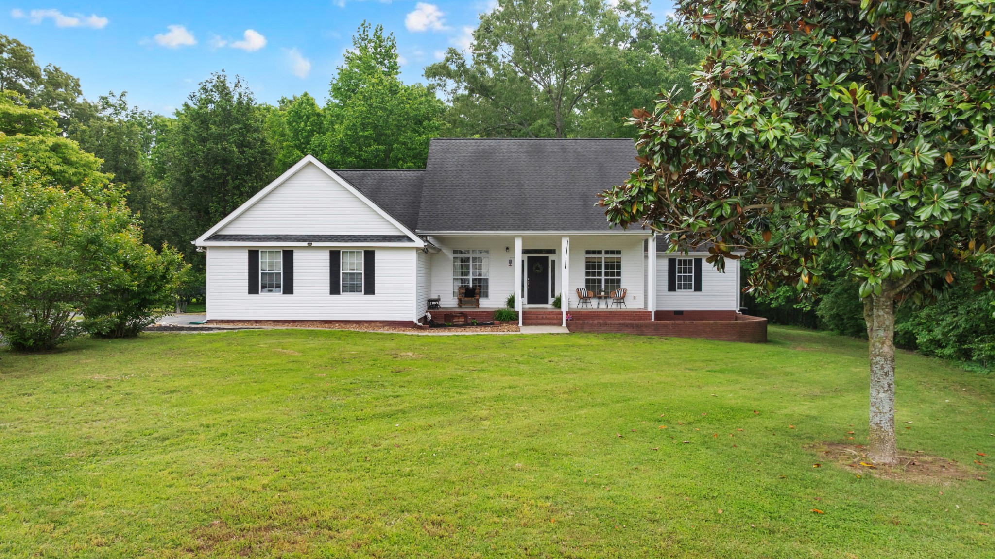 71 Larkspur Court Tullahoma, TN 37388 - Photo 26 of 31 a front view of a house with a garden