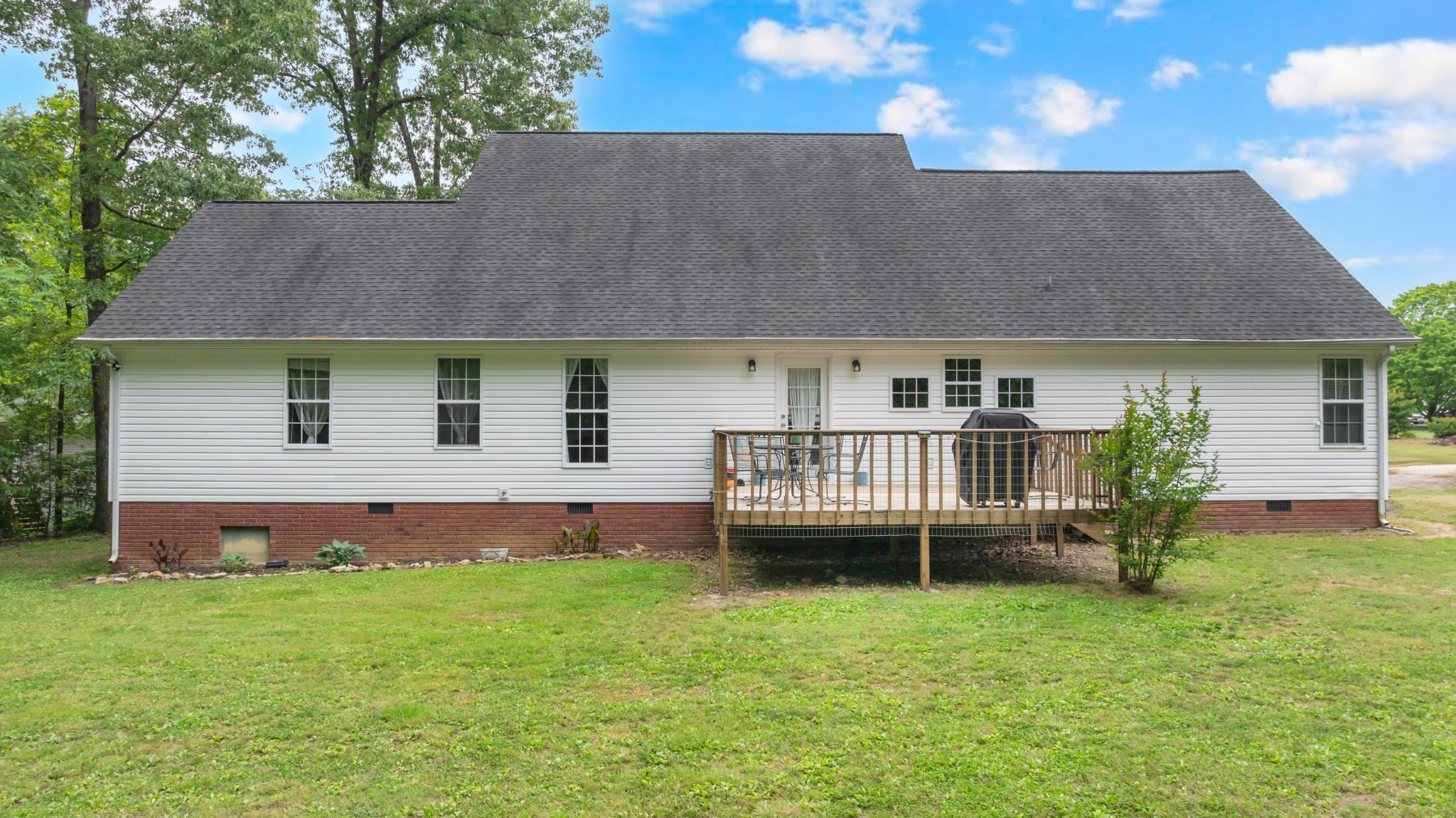 71 Larkspur Court Tullahoma, TN 37388 - Photo 30 of 31 a view of a house with a backyard and a patio