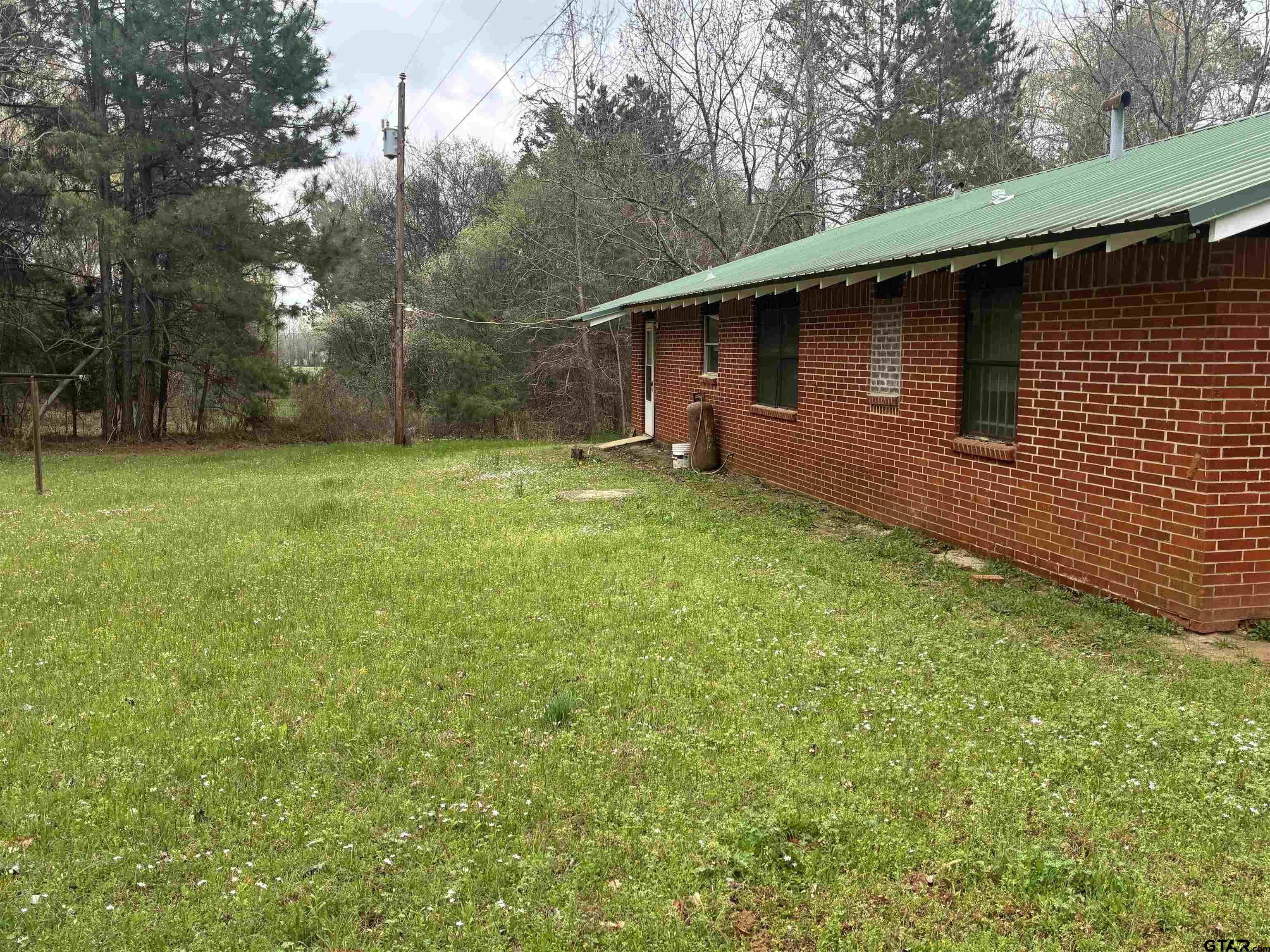 683 County Road 1209 Rusk, TX 75785 - Photo 6 of 10 a backyard of a house with lots of green space