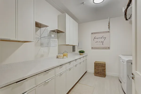 a utility room with cabinets