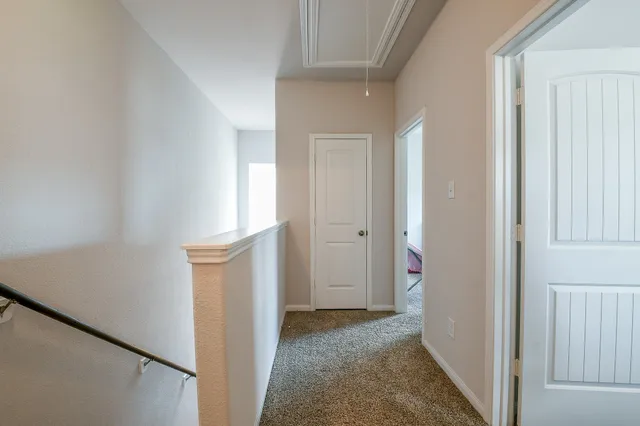 a bedroom with a bed and a chair in it