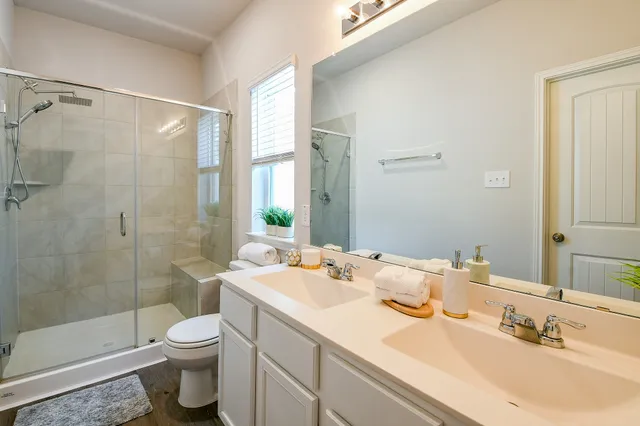 a view of walk in closet with clothes