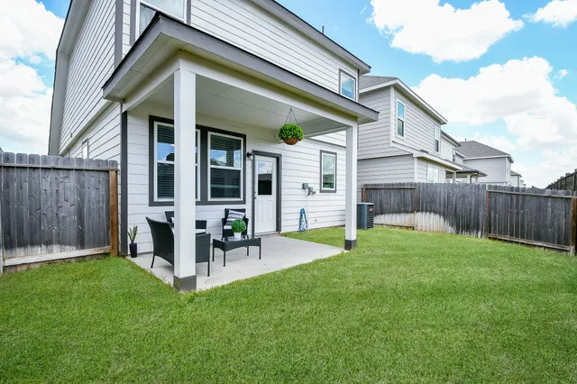 a view of a chair and tables in the balcony