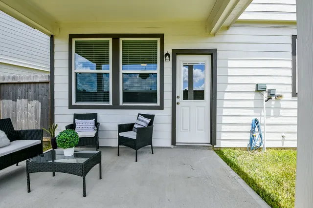 an aerial view of a house with a lake view