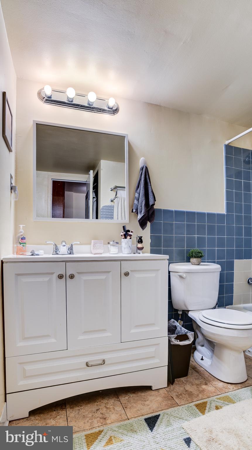 922 24th Street Northwest, Unit 115 Washington, DC 20037 - Photo 24 of 43 a bathroom with a toilet sink and mirror