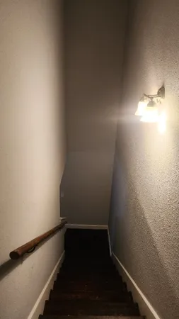 a kitchen with stainless steel appliances granite countertop a sink a refrigerator and a stove