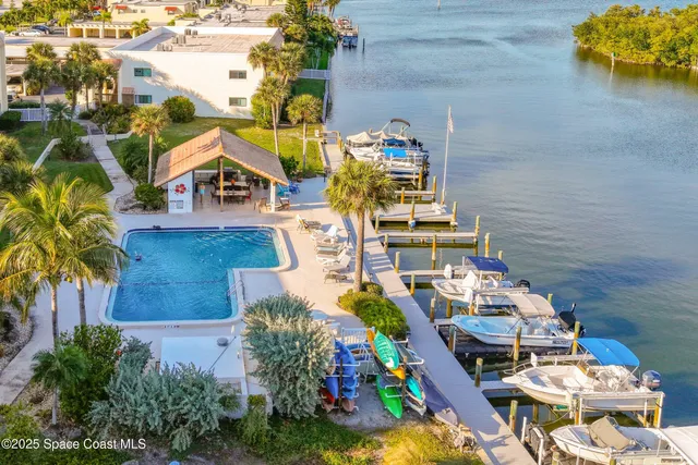 an aerial view of a house with swimming pool