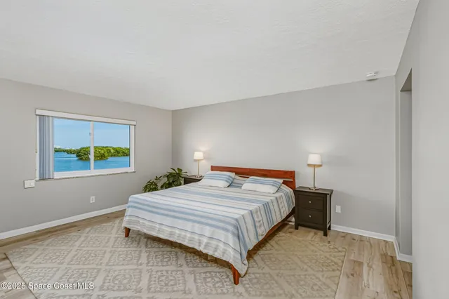 a bedroom with a bed and a cabinets