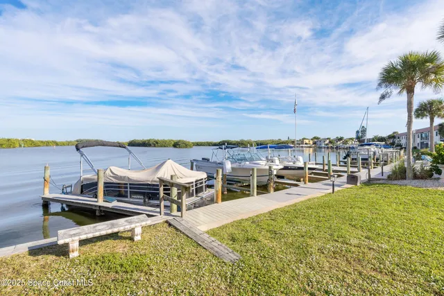 a view of a swimming pool with lounge chairs