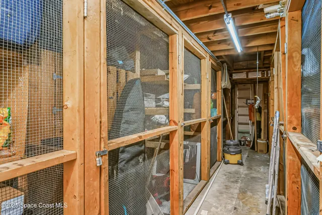 a view of swimming pool with outdoor seating and house in the background
