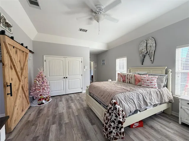 a bedroom with a bed and window