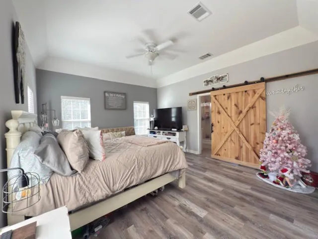 a bathroom with a tub a sink and mirror