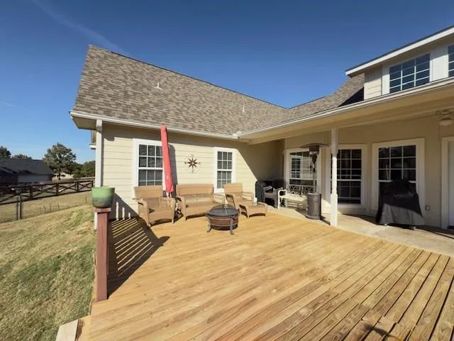 a view of a swimming pool with an outdoor seating and yard