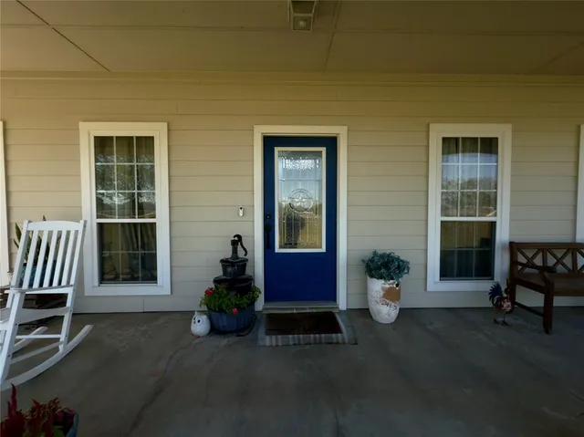 a man sitting in front of a house
