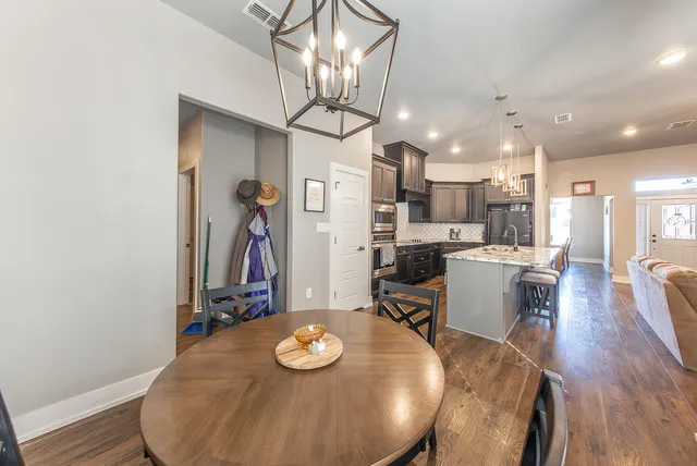 a view of a dining room with furniture