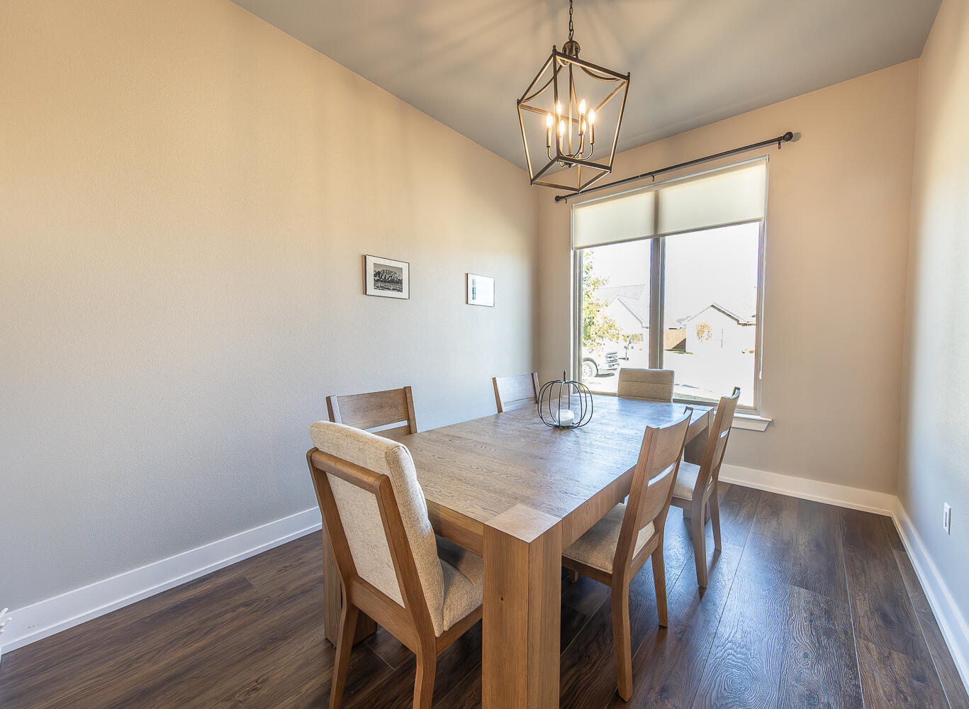 6961 103rd Street Lubbock, TX 79424 - Photo 12 of 32 a view of a dining room with furniture window and wooden floor