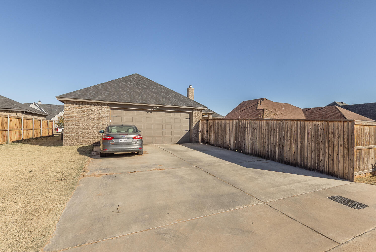 6961 103rd Street Lubbock, TX 79424 - Photo 27 of 32 a car parked in front of a house
