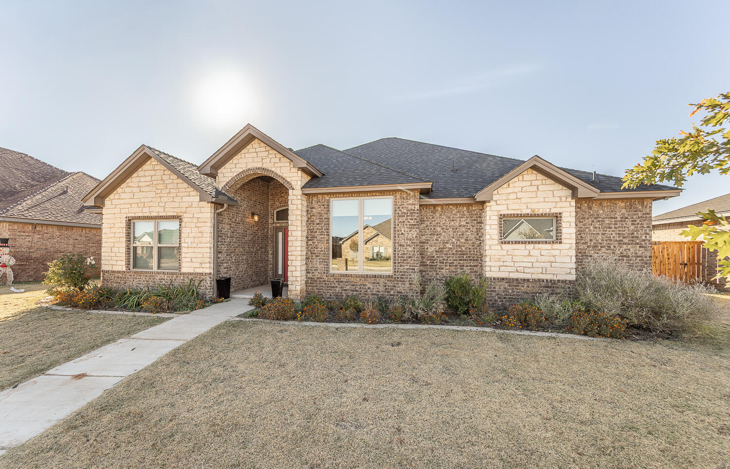 6961 103rd Street Lubbock, TX 79424 - Photo 28 of 32 front view of a house with a yard