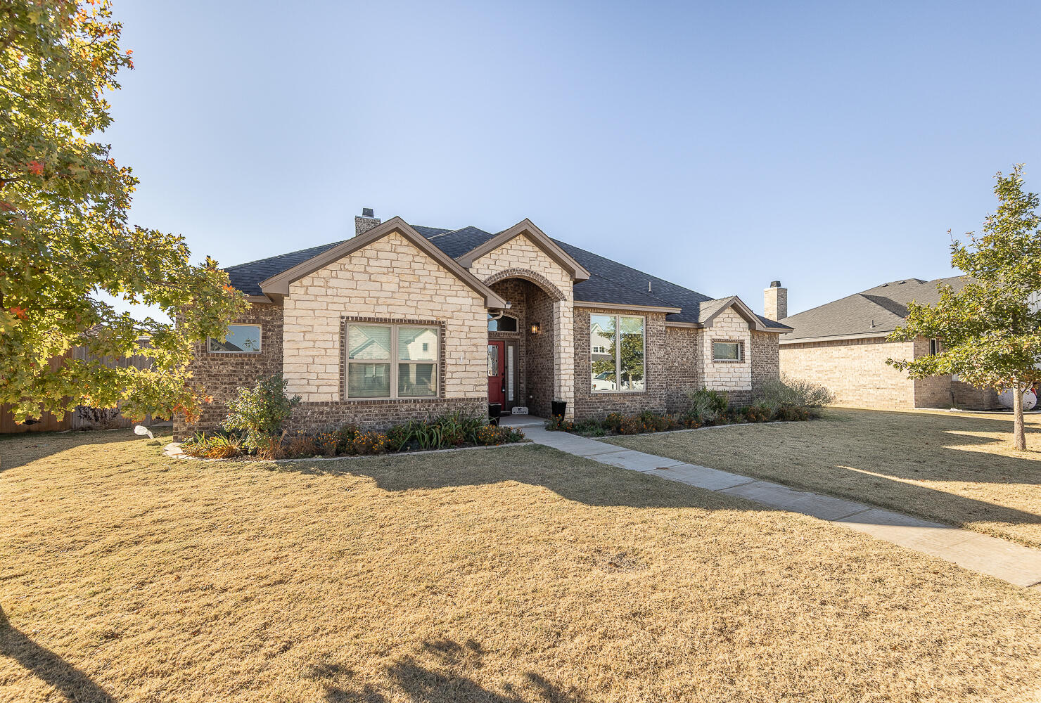 6961 103rd Street Lubbock, TX 79424 - Photo 29 of 32 a front view of a house with a yard