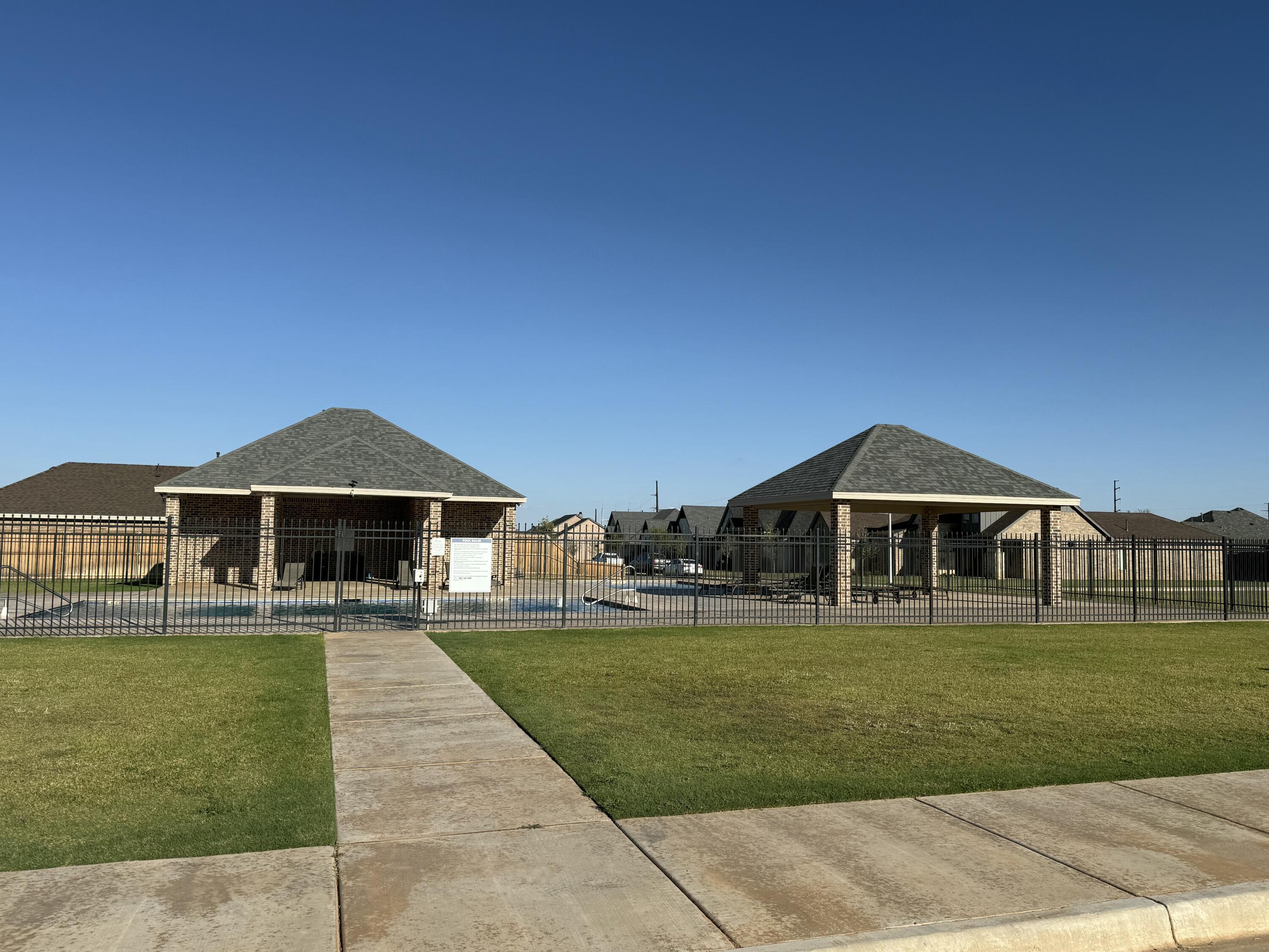 6961 103rd Street Lubbock, TX 79424 - Photo 30 of 32 a front view of a house with a yard
