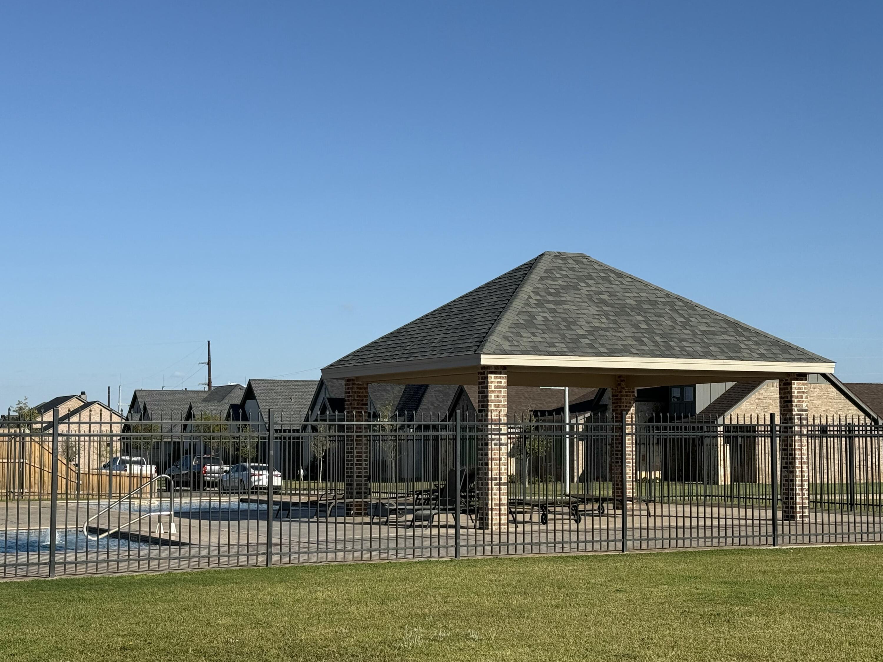 6961 103rd Street Lubbock, TX 79424 - Photo 32 of 32 a front view of a house with a garden