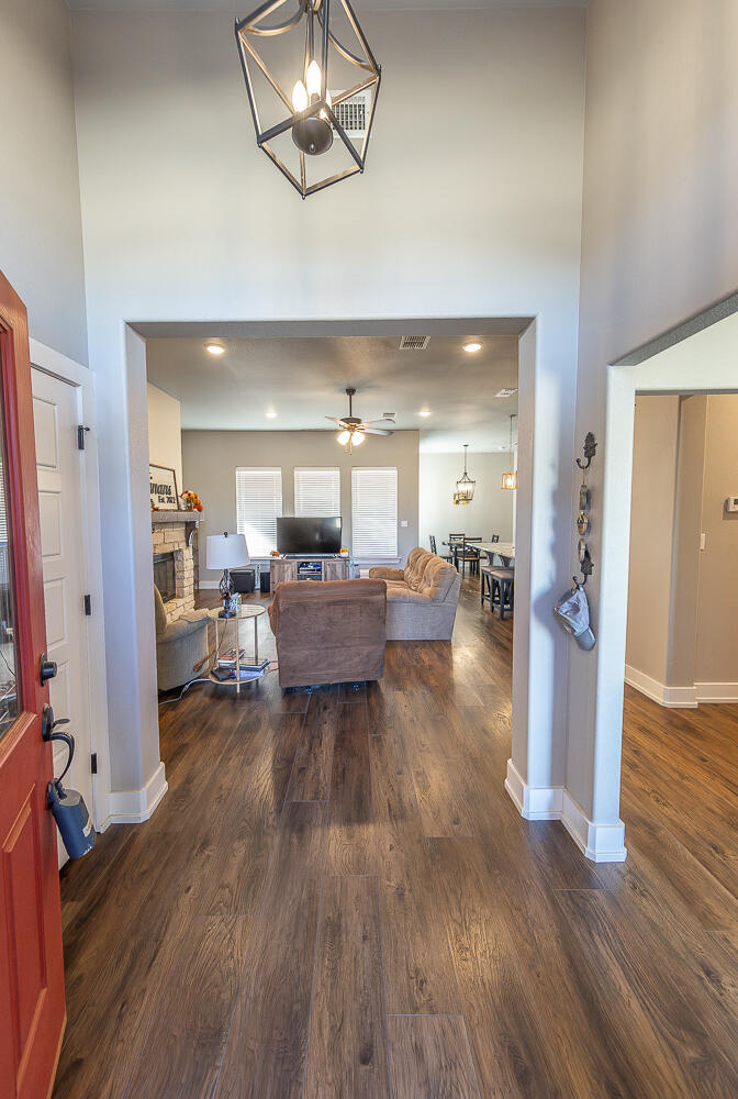 6961 103rd Street Lubbock, TX 79424 - Photo 4 of 32 a living room with furniture and a wooden floor