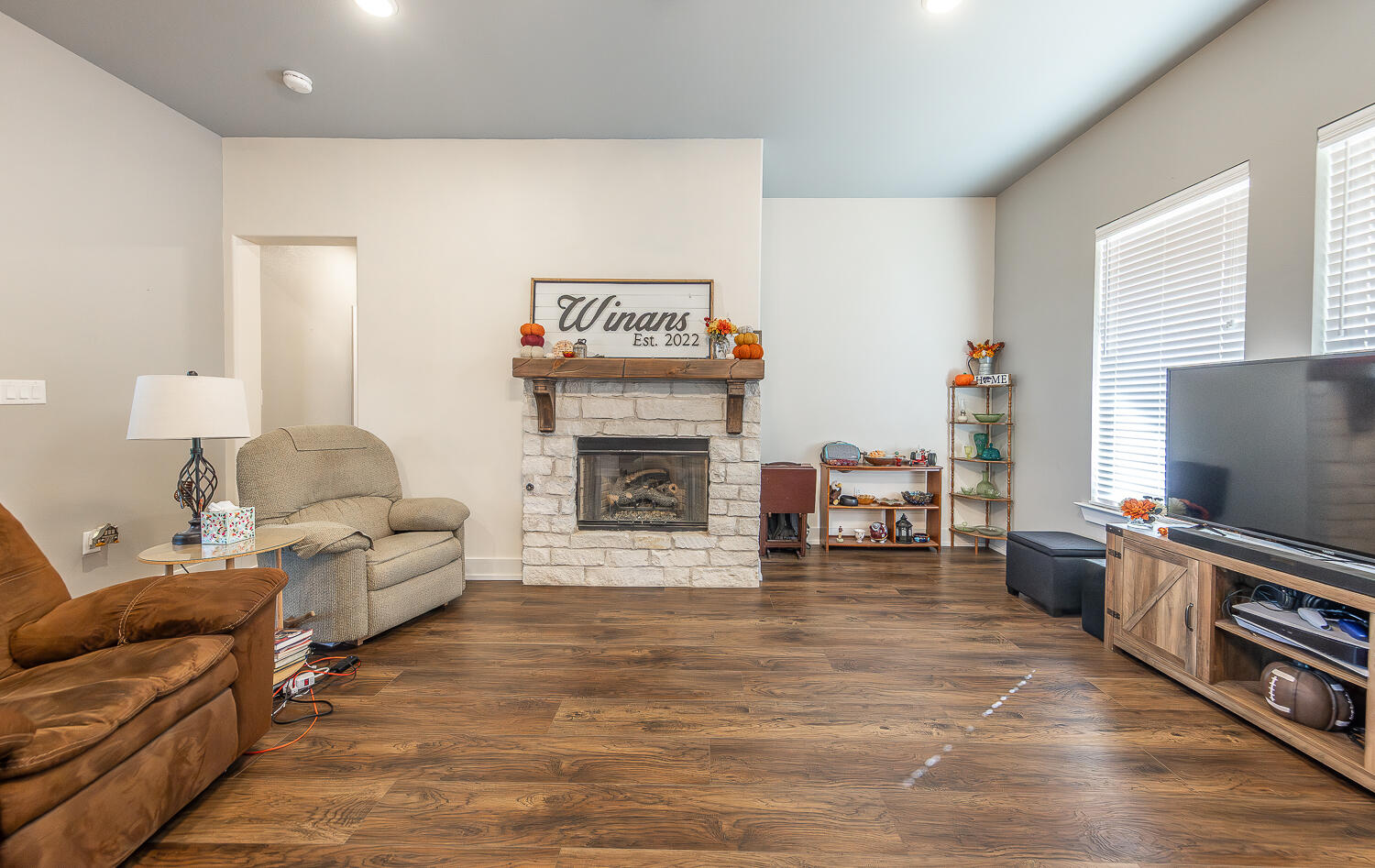 6961 103rd Street Lubbock, TX 79424 - Photo 6 of 32 a living room with furniture and a fireplace