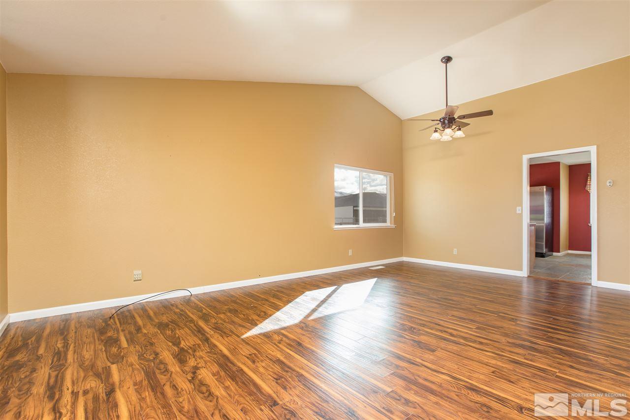 10475 Osage Road Reno, NV 89508 - Photo 4 of 25 wooden floor in an empty room with a window