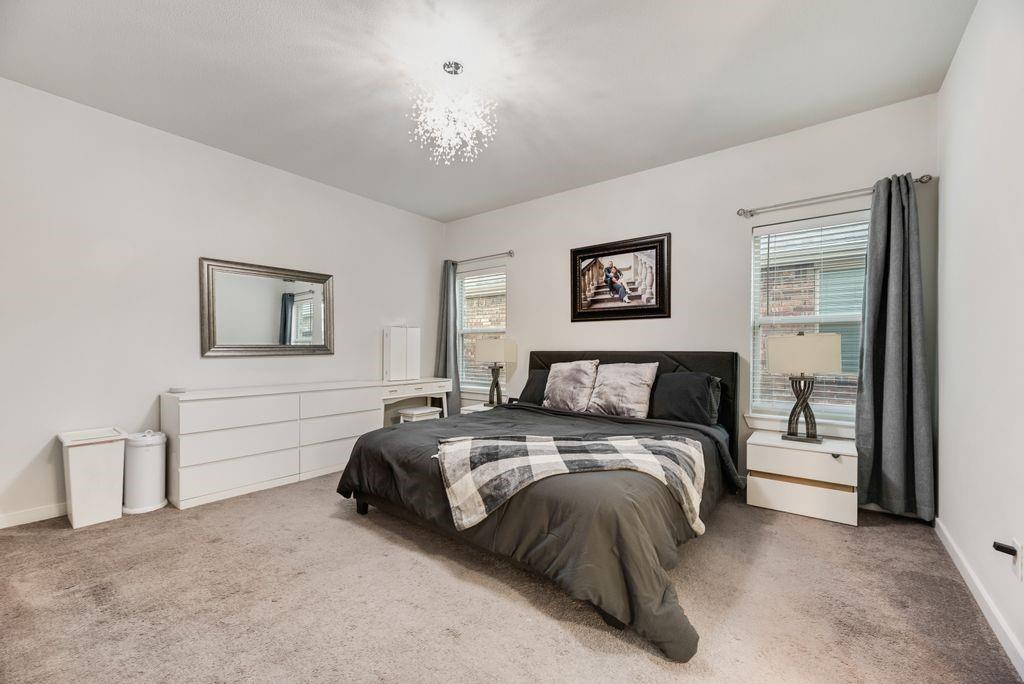 2702 Runnels Court Forney, TX 75126 - Photo 16 of 32 This spacious room features neutral-toned carpeting, white walls, and a modern light fixture