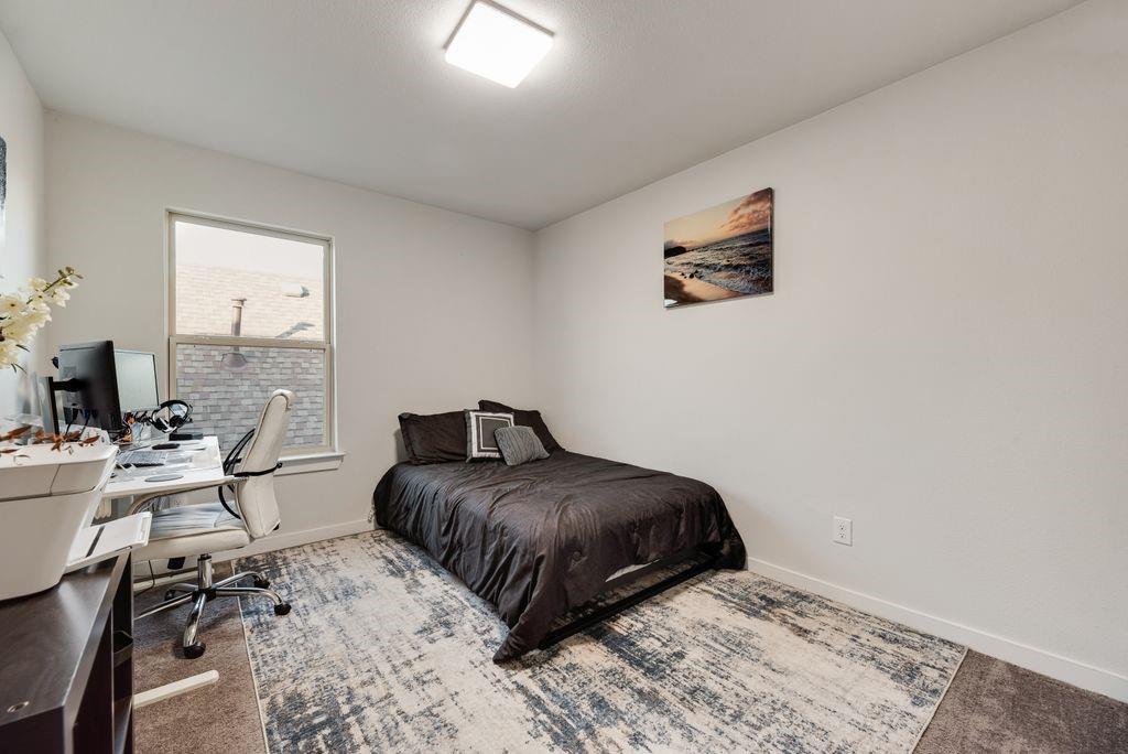2702 Runnels Court Forney, TX 75126 - Photo 20 of 32 This versatile room features a window providing natural light, a neutral color palette, and a rectangular ceiling light fixture